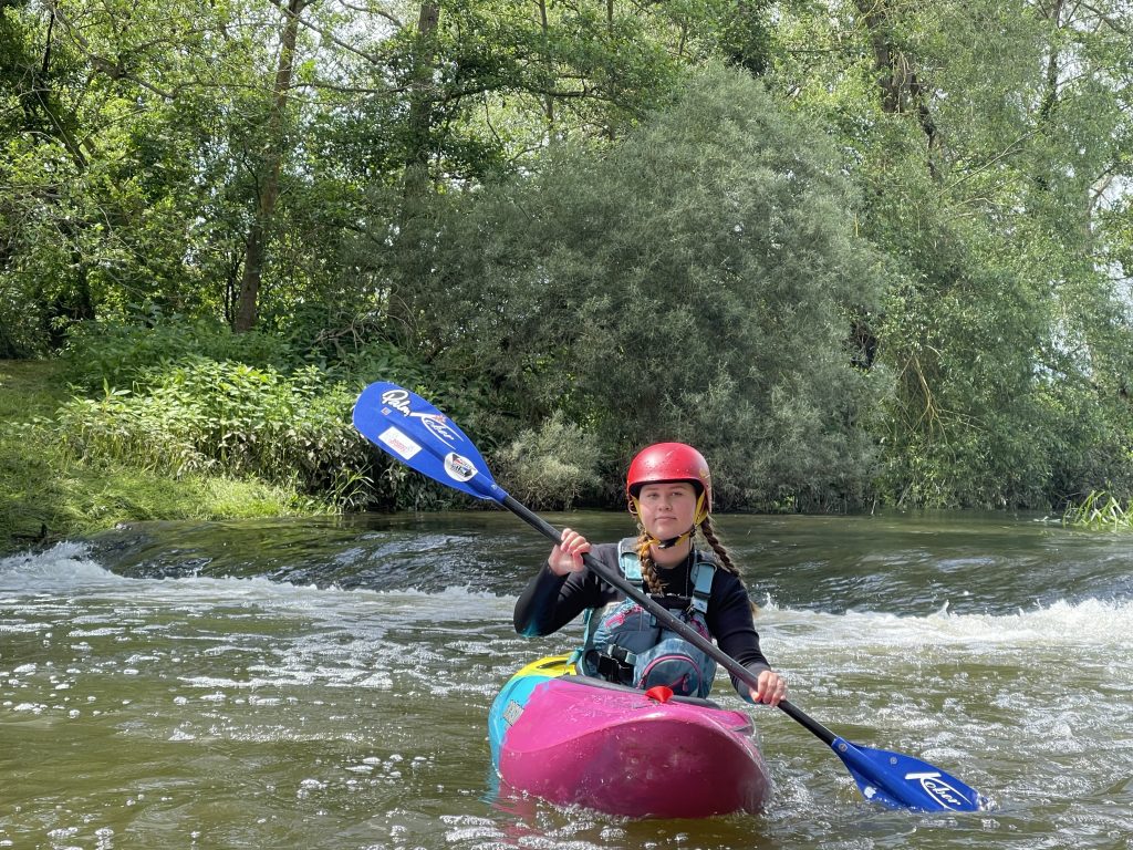 Paddling on the weirs on the River Stour  with Whoosh Explore canoe Club.